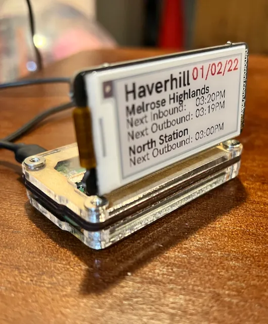 InstantMBTA showing train schedule on an Inky pHAT e-ink display
