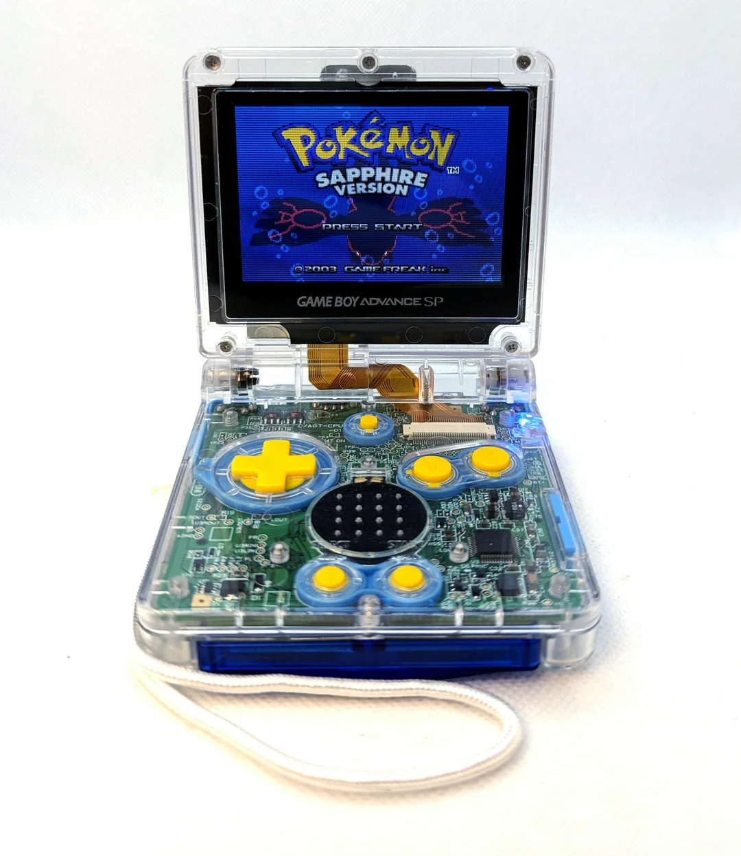 Image of modified Game Boy Advance SP with transparent shell by @Bklyn_mando_modz