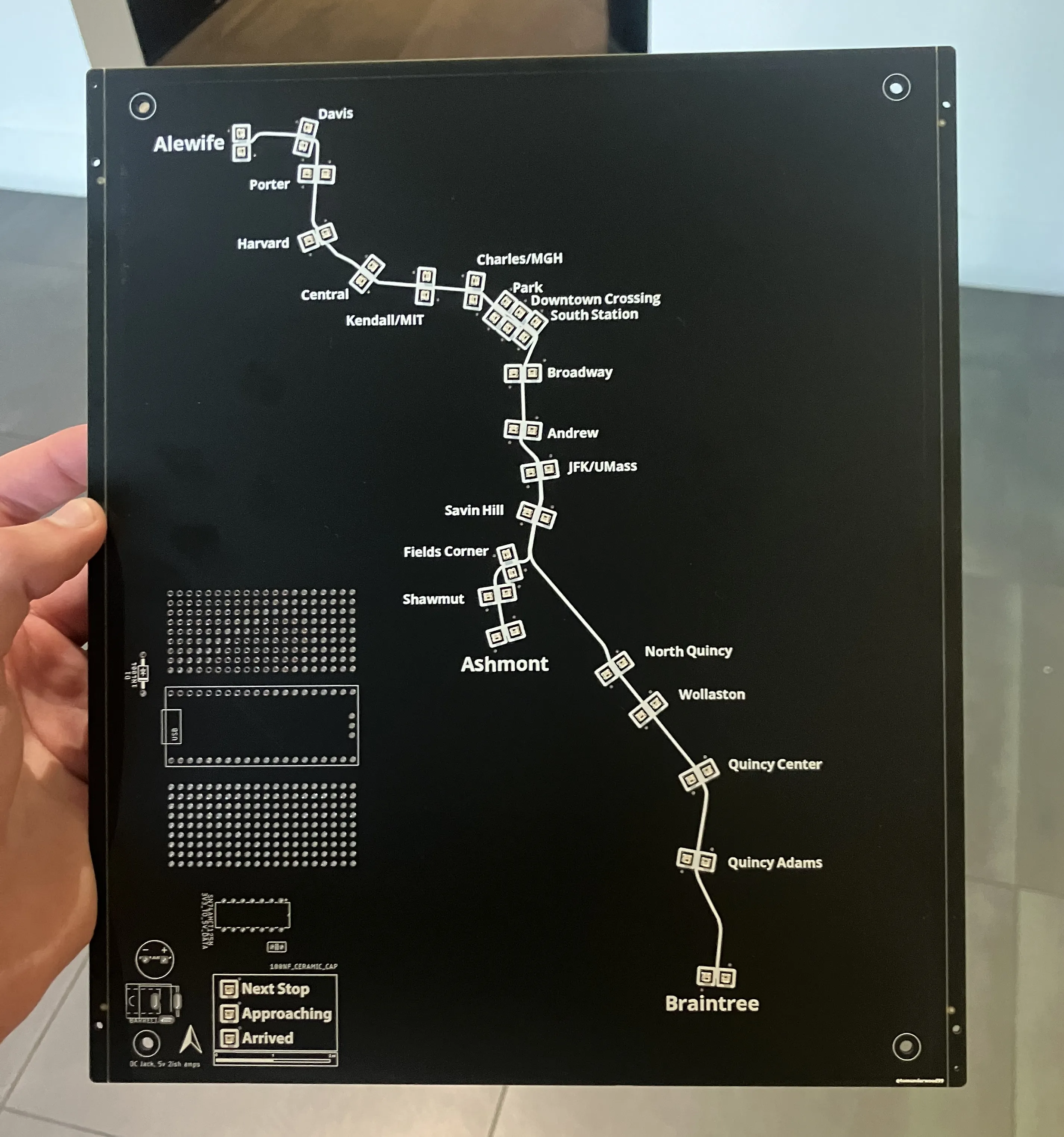 Photo of the completed CharlieBoard PCB (fourth generation) with LEDs, components, and routed traces visible.