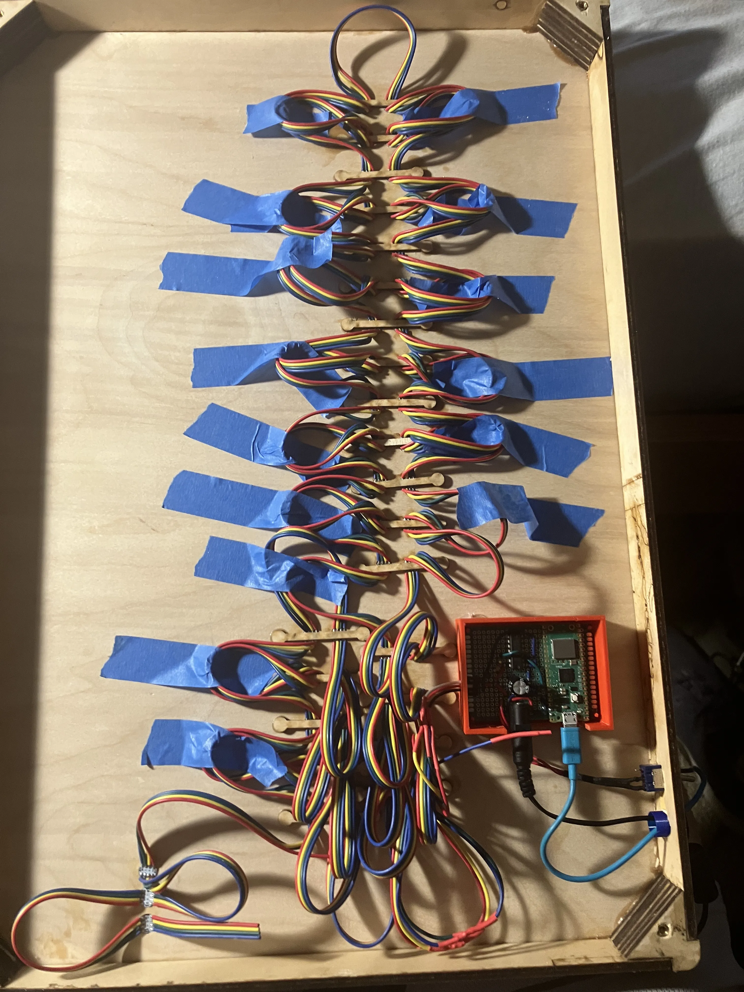 Photo of the insides of the third generation CharlieBoard display, showing electronics and wiring.